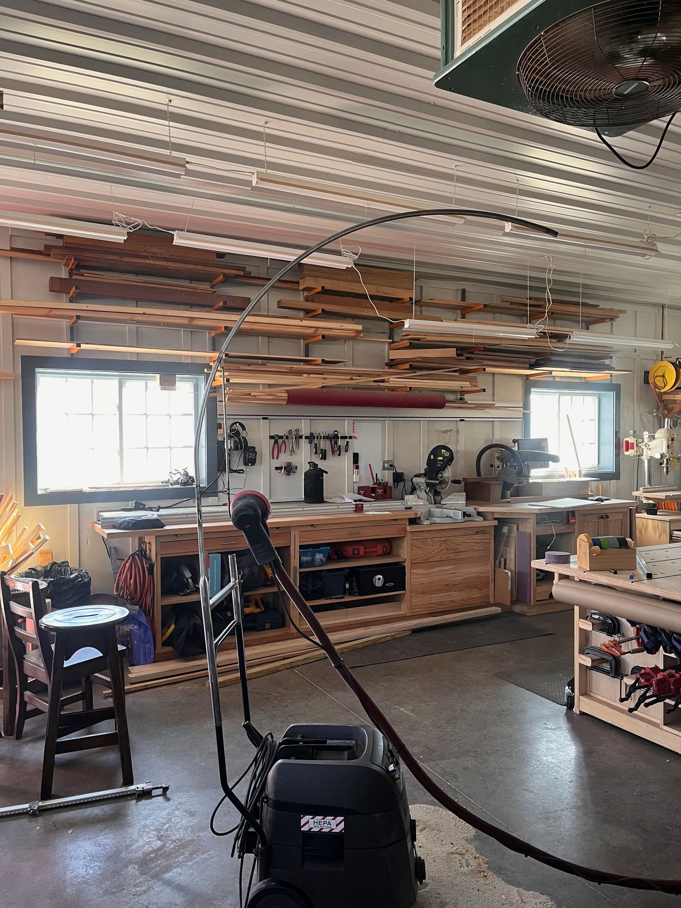 The shop floor: workbenches, lumber racks, and machines